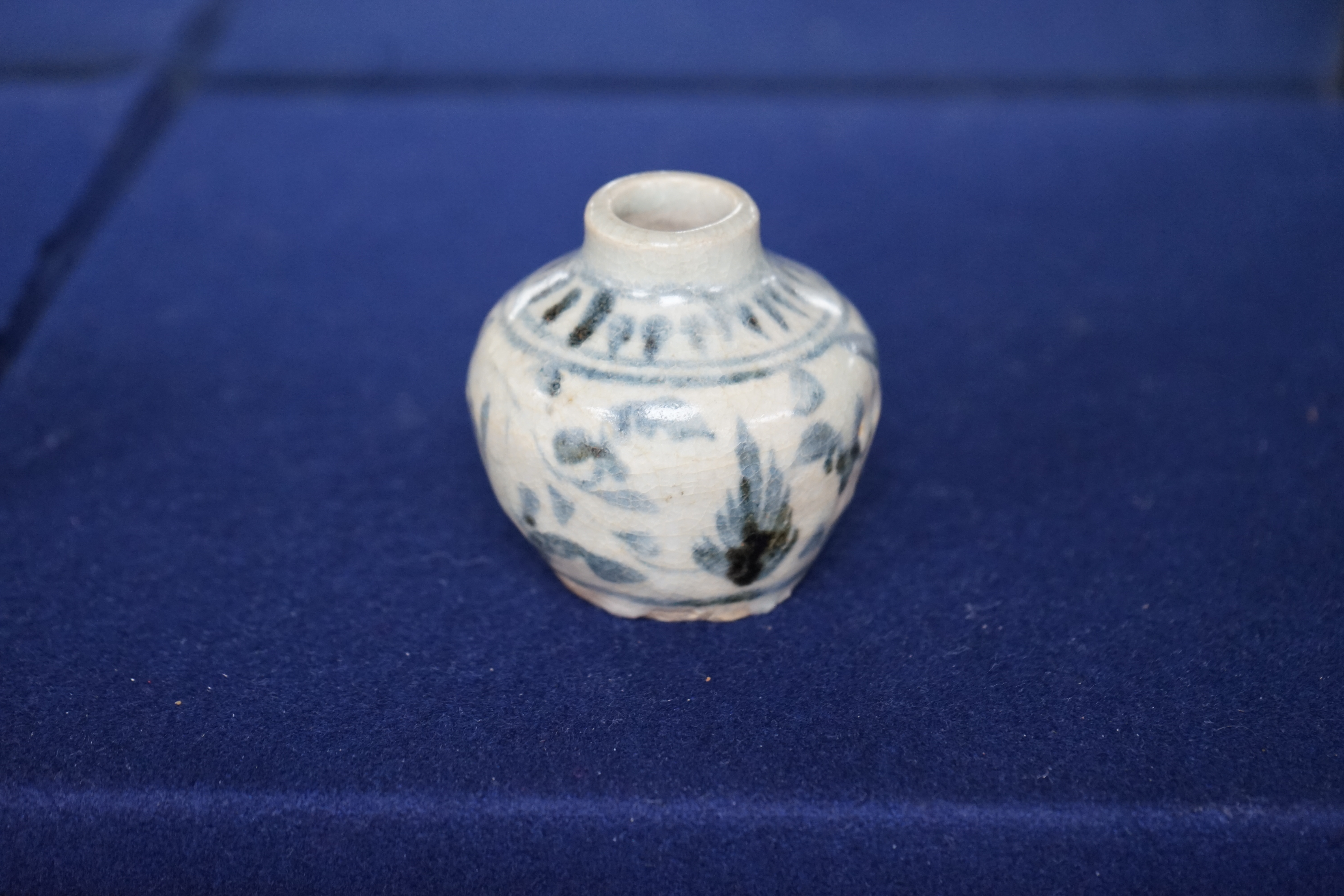 A Chinese blue and white jarlet and a tang dynasty glazed jarlet, 9cm. Condition - commensurate with age